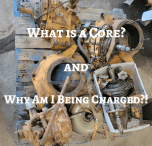 twxt what is a coree and why am i being charged in white bold over a background of a dirty disassembled dace backhoe transmission