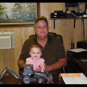 brent in his office with granddaughter