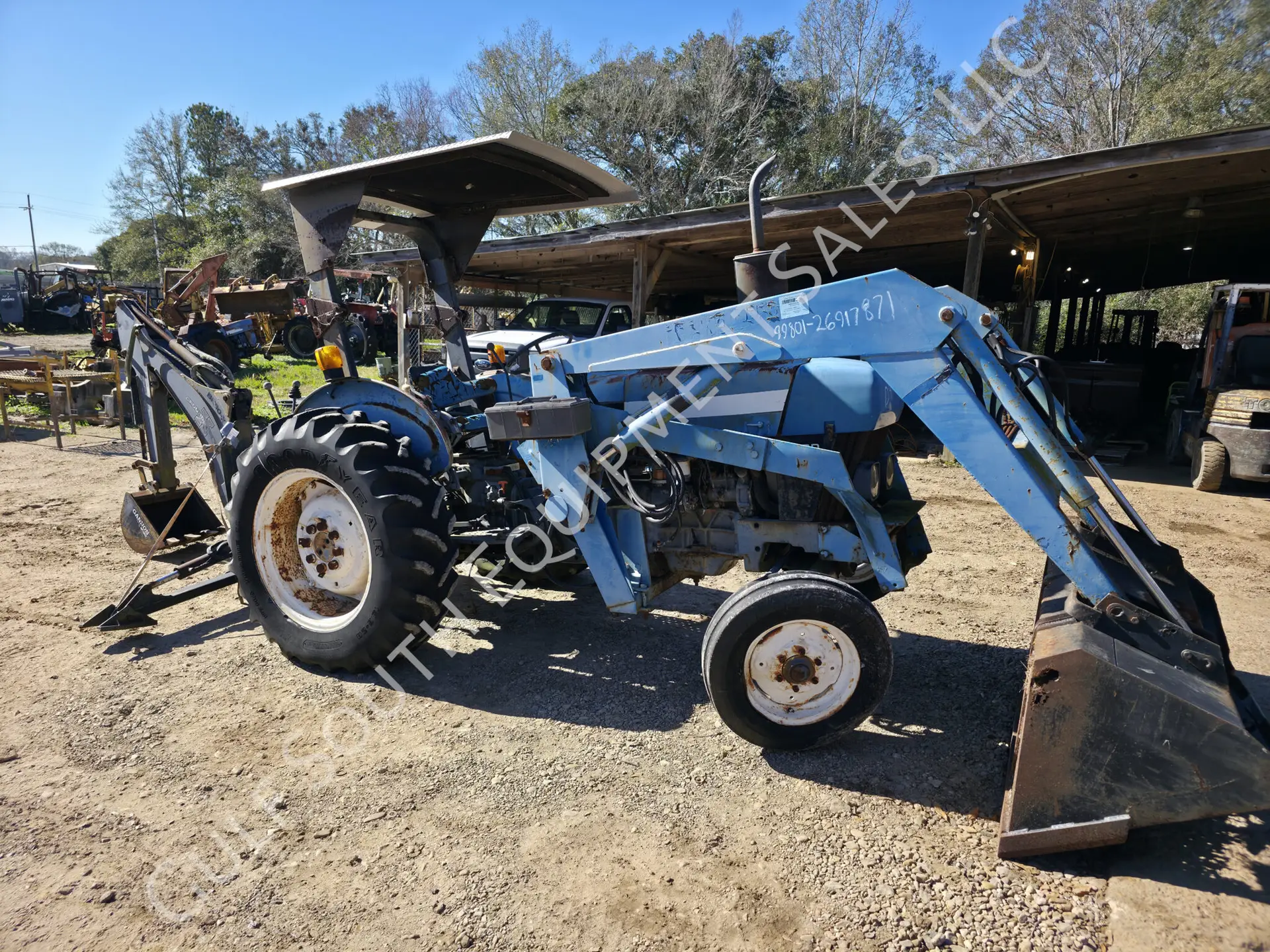 New Holland 3930 with Loader and Backhoe Attachments in for Salvage